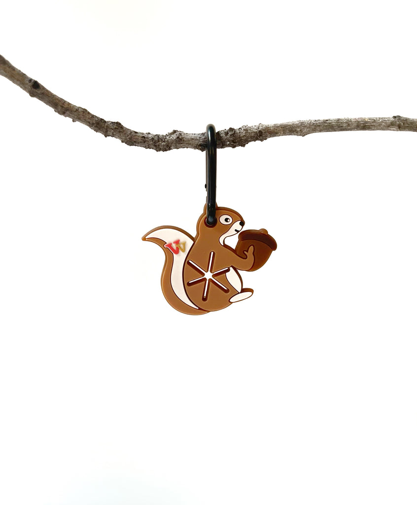 hanging squirrel dog poo bag carrier which attaches to leash with carabiner