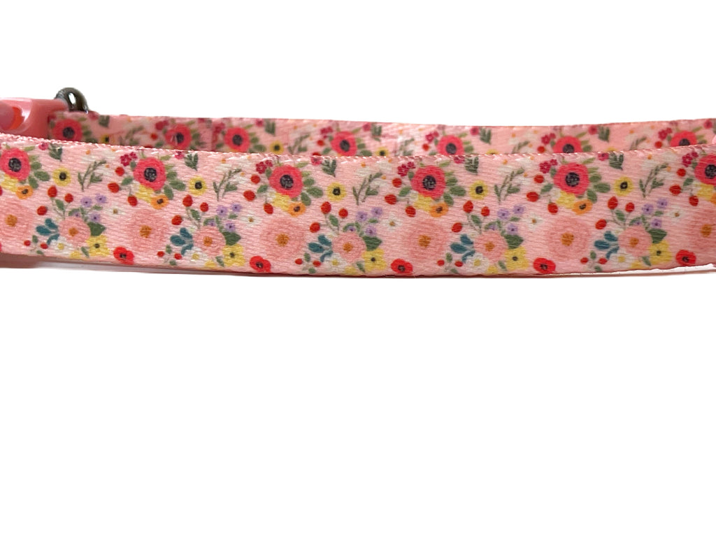 Close up of the light pink and colorful floral pattern nylon dog collar