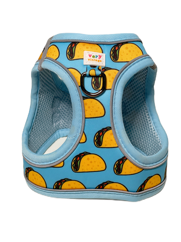 light blue with yellow taco small dog harness vest with velcro closure. It is soft and secure for everyday dog walks.