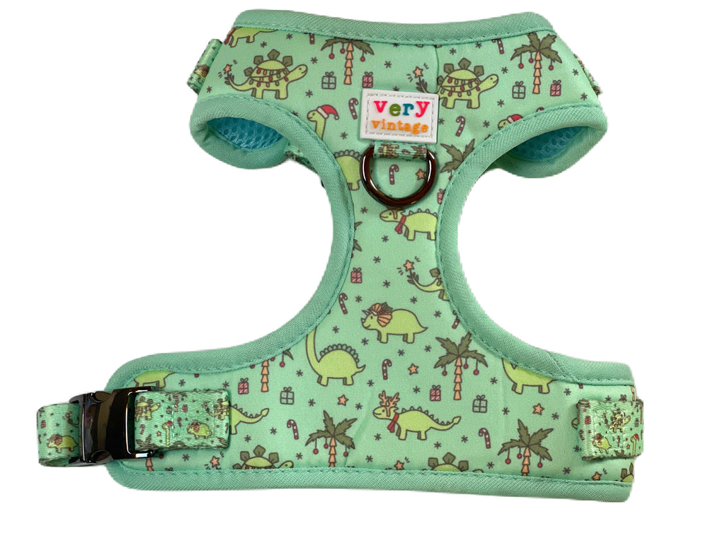light green with Christmas dinosaurs complete with Christmas lights on them and palm trees adjustable dog harness