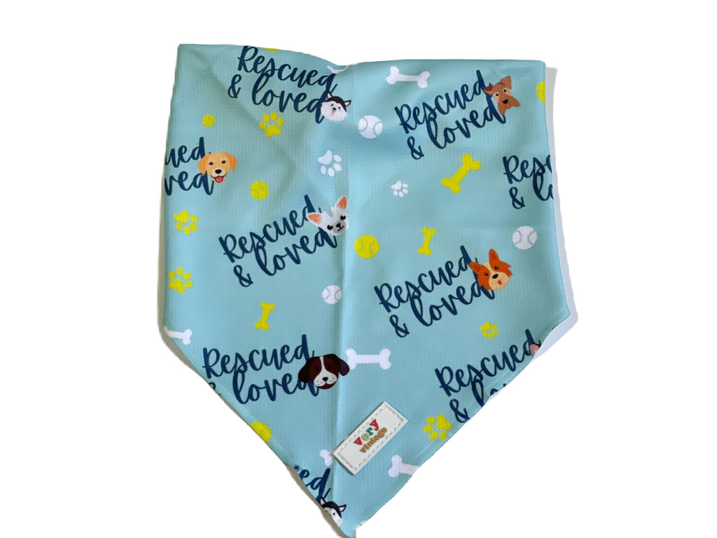 light blue with "rescued and loved" written on it cooling mesh dog bandana