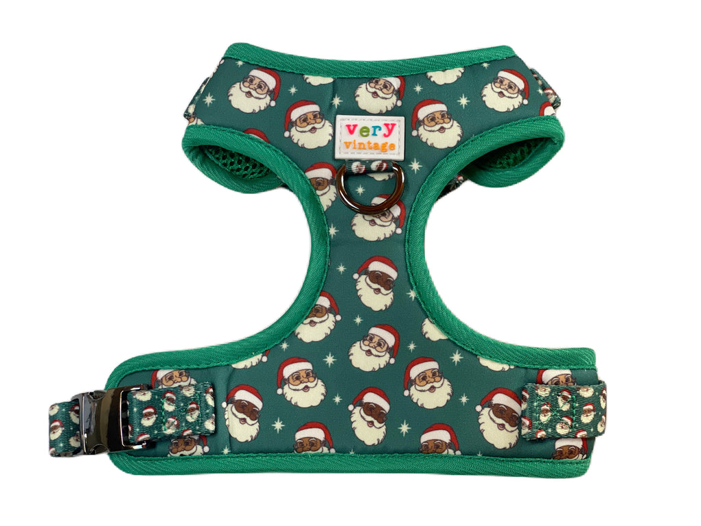 A festive and stylish dog harness featuring a multiethnic Santa design. Adjustable straps and durable materials make it perfect for all breeds.