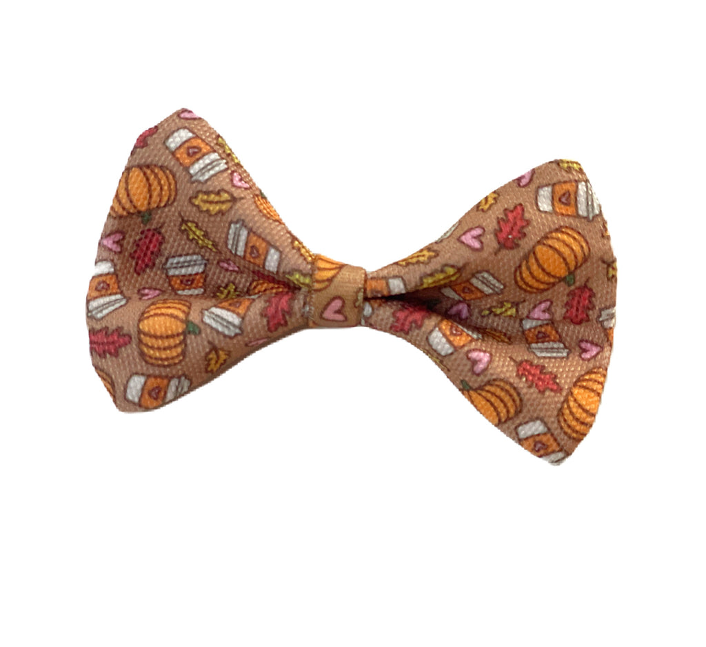 light brown with pumpkins, fall leaves and pumpkin spice lattes dog bowtie with easy and secure elastic attachment.