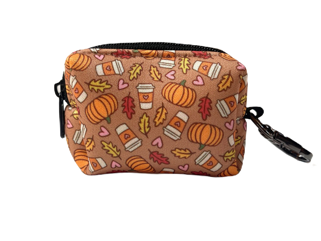 light brown with orange pumpkins and fall leaves with pumpkin spice lattes dog waste bag holder for fun and stylish dog walks.