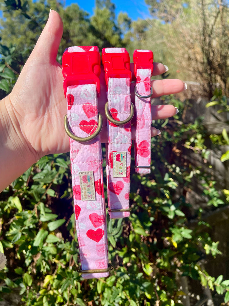 Handmade Valentine’s Day dog collar in light pink cotton with pink and red conversation hearts. Eco-friendly and soft, perfect for your pup to celebrate love in style. Custom sizes available.