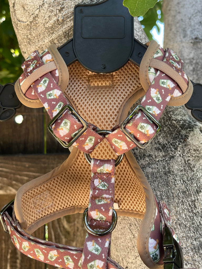 Stylish and functional dog harness in a chocolate brown coffee latte pattern. Adjustable straps ensure a comfortable fit for all dog sizes.