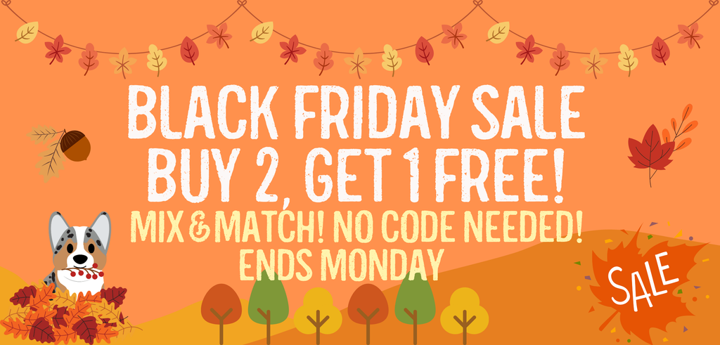 Black Friday sale banner with fall leaves, a corgi in autumn foliage, and text promoting a buy 2 get 1 free pet accessory sale