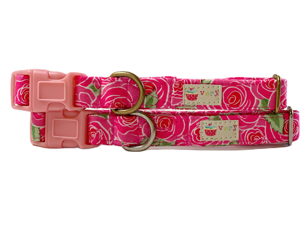 Handmade organic cotton dog collar featuring a vibrant hot pink background adorned with bold cabbage roses in shades of pink, red, and green. Available in custom sizes for dogs and cats, with antique brass or silver hardware. Breakaway buckle option for cats for added safety.