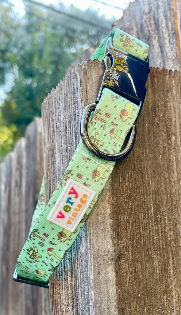 Mint green Festive Dinos collar with black metal hardware and candy cane print