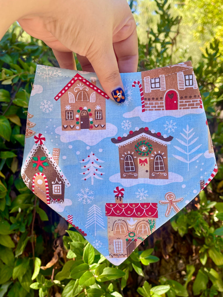 Blue holiday dog bandana with gingerbread houses and snowflakes, handmade in Los Angeles