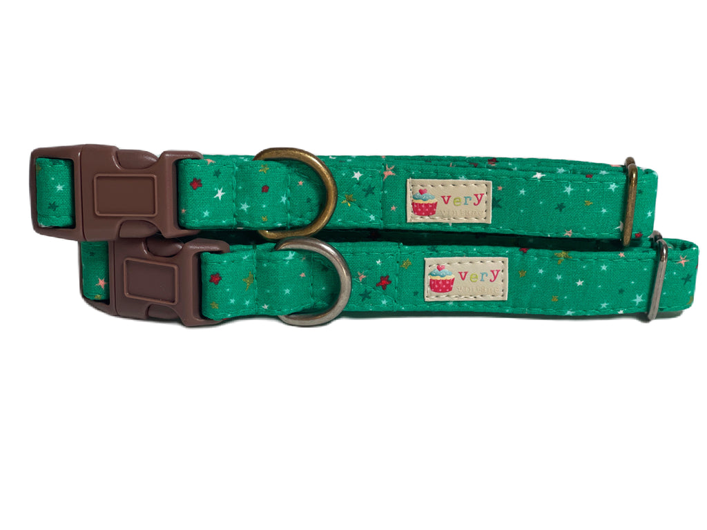 A close-up of the green collar with colorful stars, showcasing the vibrant and whimsical design. Available with antique brass or antique silver hardware, this collar adds a fun, playful touch to your pet’s look. Perfect for pets with a fun personality!