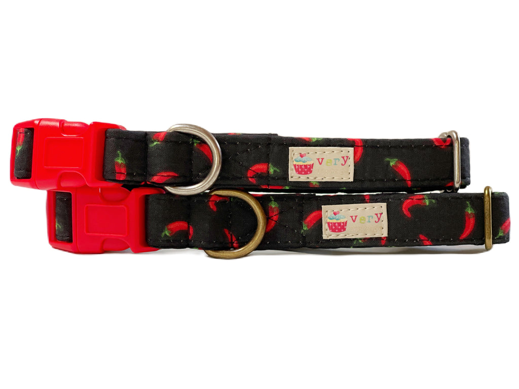 Black with fun red chili pepper patterned dog and cat collar. Handmade in the USA. Made from organic cotton. Strong and secure.