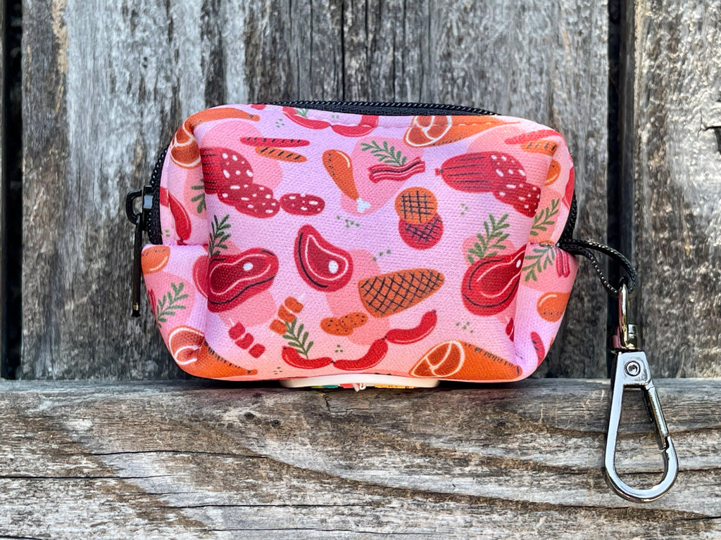 Red mod-style poop bag dispenser with meat pattern, perfect for on-the-go cleanups.