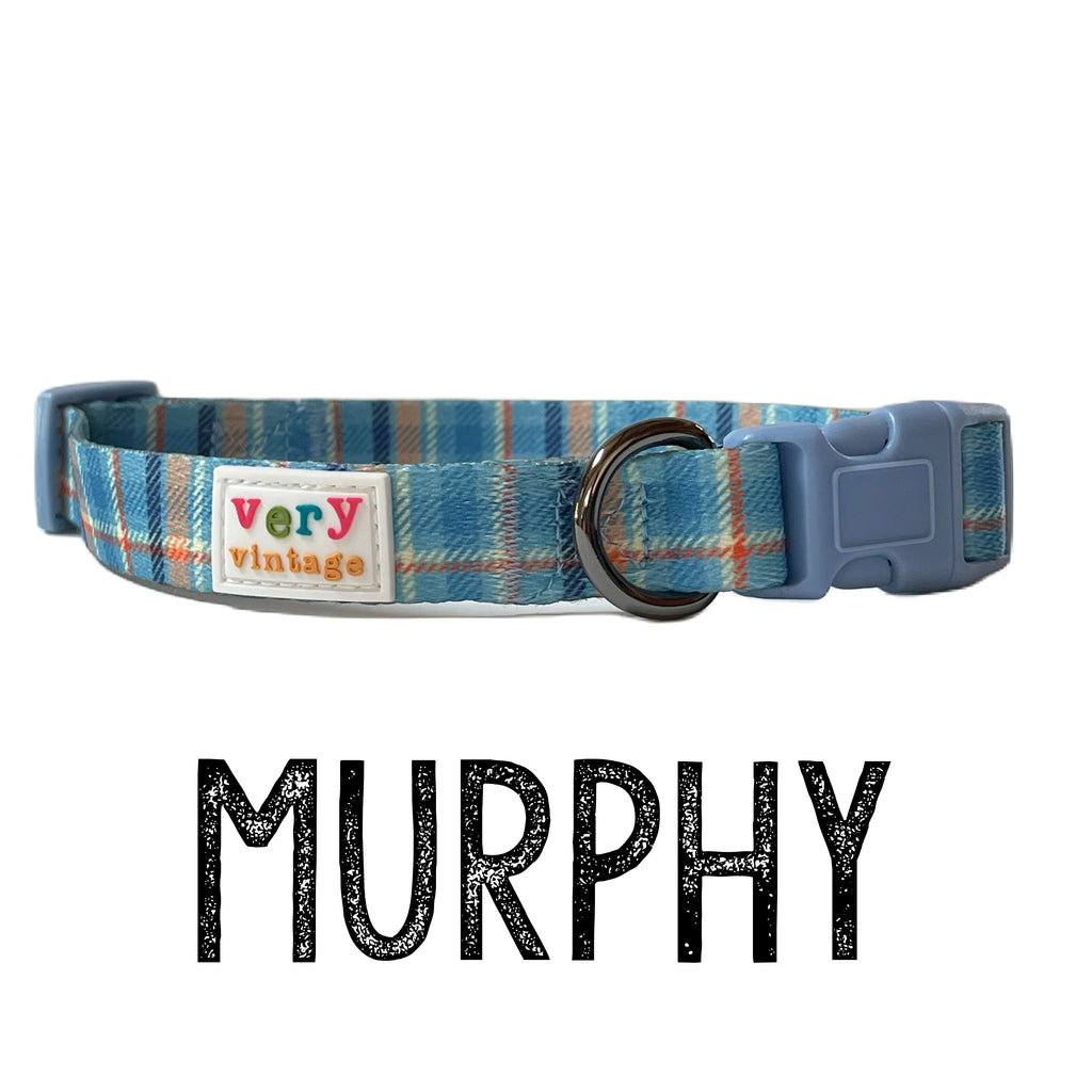 Tartan dog collars in blue, orange, cream, and navy plaid