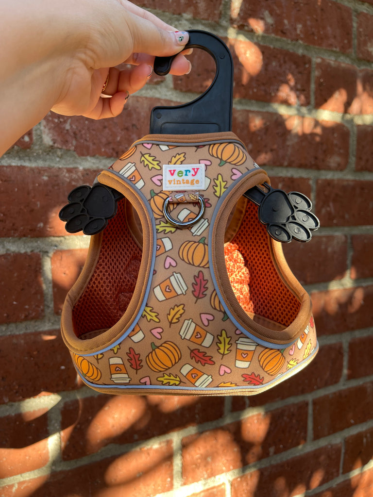 A cozy and festive dog harness vest that's perfect for fall adventures. The pumpkin spice latte pattern and no-pull, no-choke design ensure your small dog stays comfortable and safe.