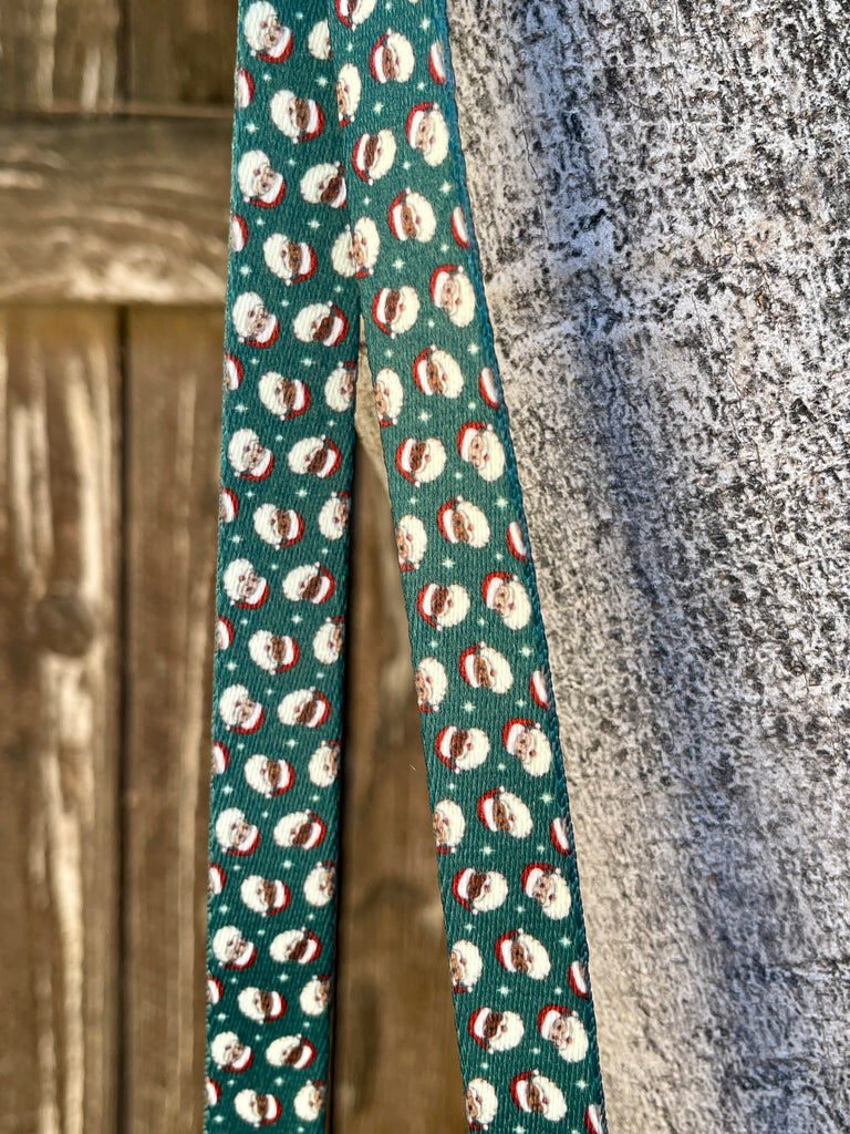 Retro Santa print dog leash hanging against rustic wood background