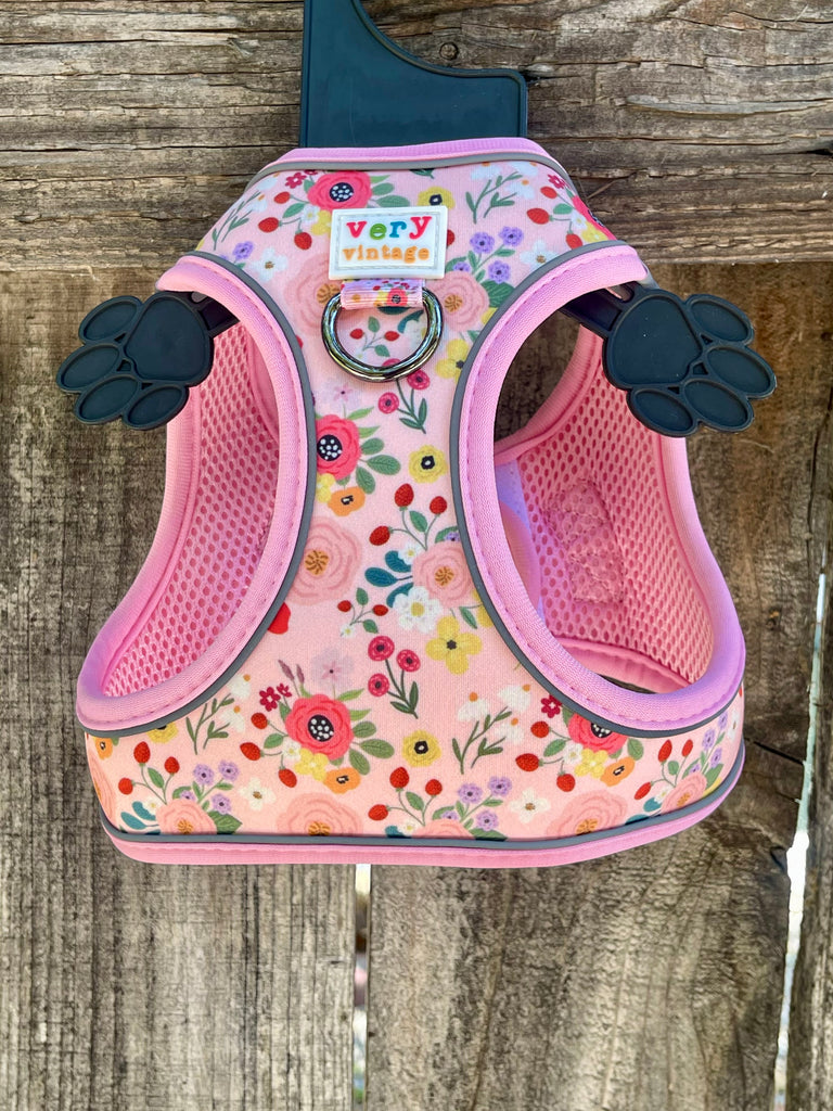 Pink floral step-in dog harness photographed outdoors in natural light, showcasing the product's design and color accuracy