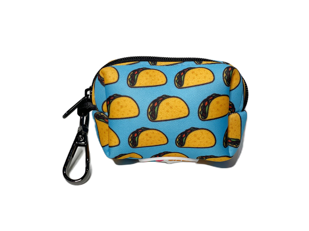 Close-up of an eco-friendly taco print dog poop bag holder with a clip and dispenser.