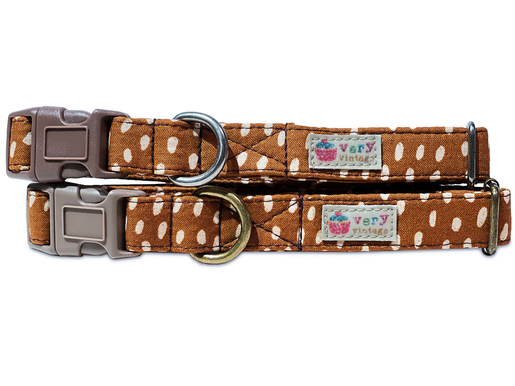 Handmade organic cotton dog collar featuring a playful brown and white irregular polka dot pattern. Available in custom sizes for dogs and cats, with antique brass or silver hardware, and a breakaway buckle for added safety for cats.