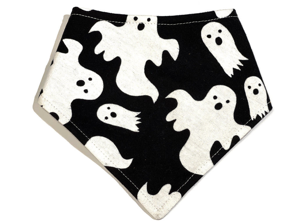 Handmade in Los Angeles. Black dog bandana featuring a spooky white ghost pattern, perfect for Halloween. This bandana also glows in the dark.