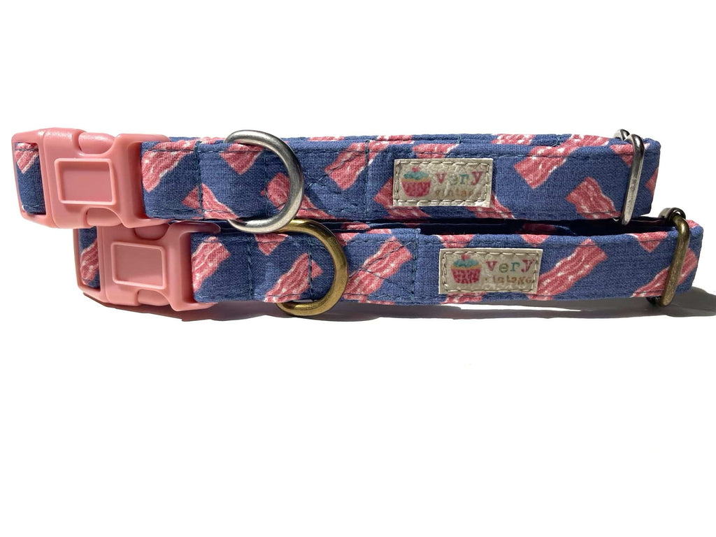 A close-up of the blue collar with pink bacon strips, showcasing the fun and quirky design. Available with antique brass or antique silver hardware, this collar is perfect for pets who love bacon and playful patterns. Cat collars come with breakaway safety collars.