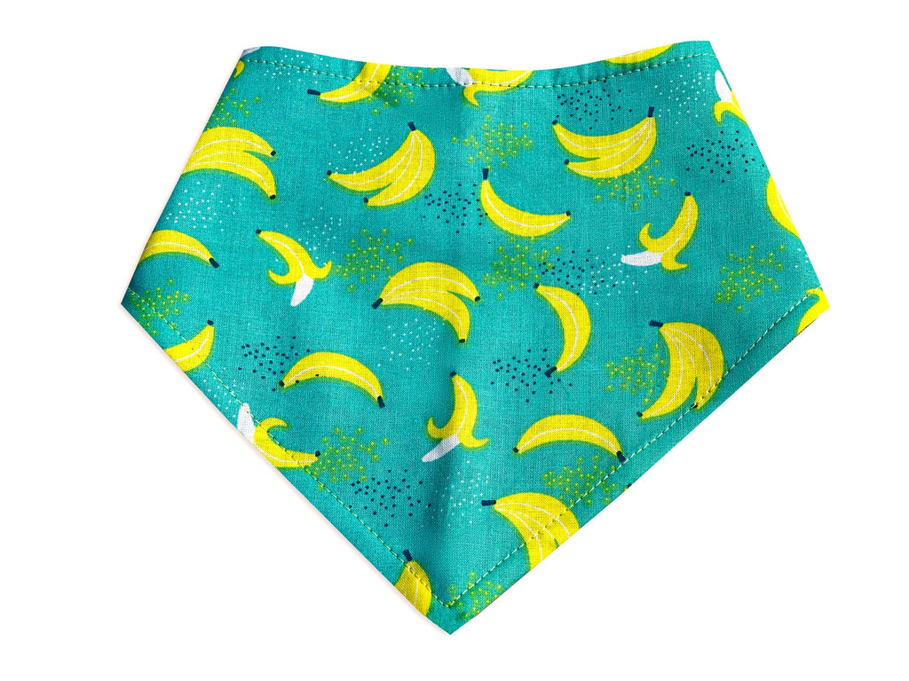 Adjustable dog bandana featuring a playful banana design.