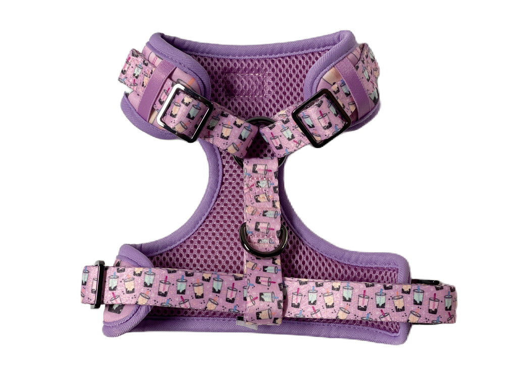 Purple mesh adjustable dog harness with breathable padding. Durable design with secure buckles for active dogs.