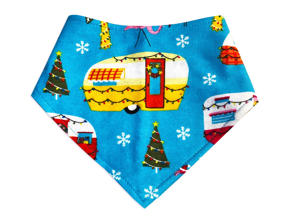 Bright blue dog bandana with a playful pattern of Christmas RV campers. Made from organic cotton, this adjustable bandana features three snaps for a secure fit. Available in various sizes and handmade in Los Angeles