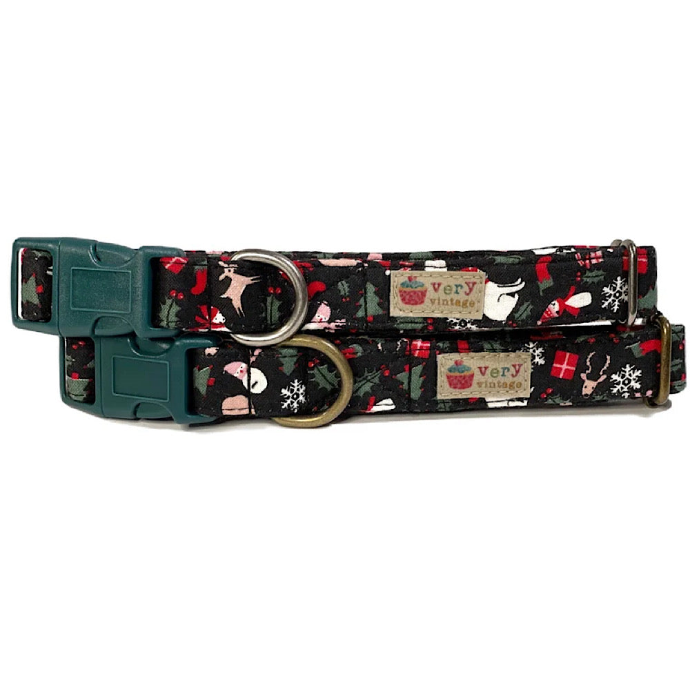 Handmade organic cotton Christmas collar featuring a black background with a festive all-over print of Santa, presents, and holiday-themed icons. Perfect for holiday celebrations, available for dogs and cats in custom sizes.