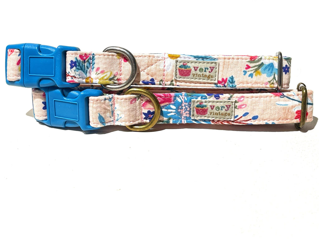 Handmade organic cotton dog and cat collar in a warm desert tan color, featuring vibrant floral bursts in shades of pink, blue, orange, and yellow. A stylish and eco-friendly accessory perfect for adding a pop of color to your pet's wardrobe