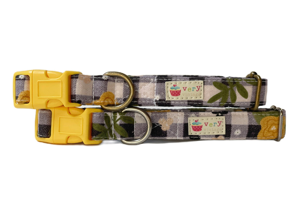 Handmade organic cotton dog and cat collar featuring a black and gray checkered plaid design with bright yellow floral accents. A country-chic style with a touch of rustic charm, perfect for adding a floral pop to your pet's wardrobe.