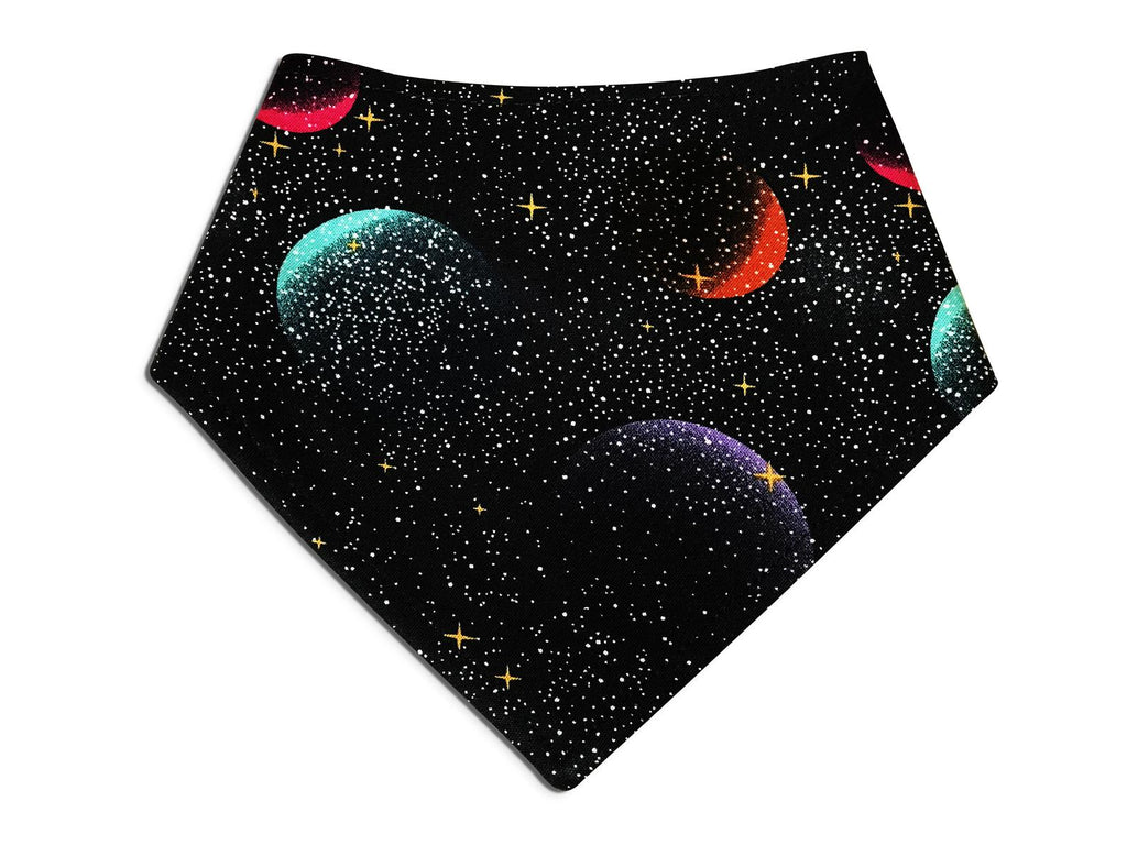 Dog bandana featuring a dark blue galaxy print with shimmering gold stars and colorful planets