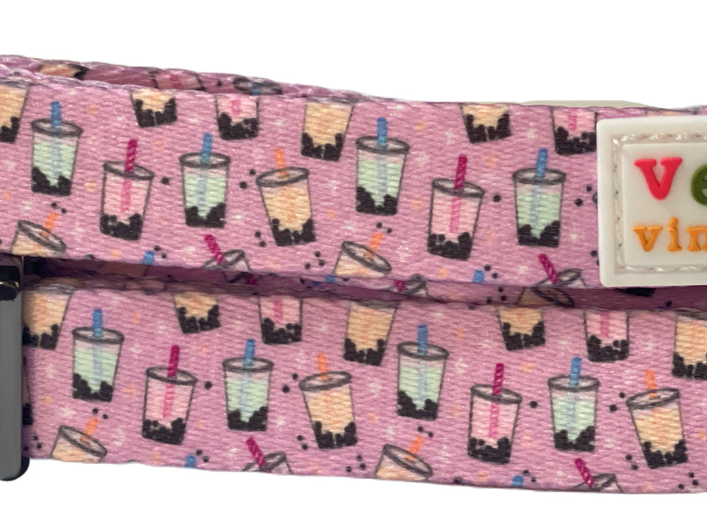 close up of the boba time dog collar with pink, blue, orange bubble tea cups