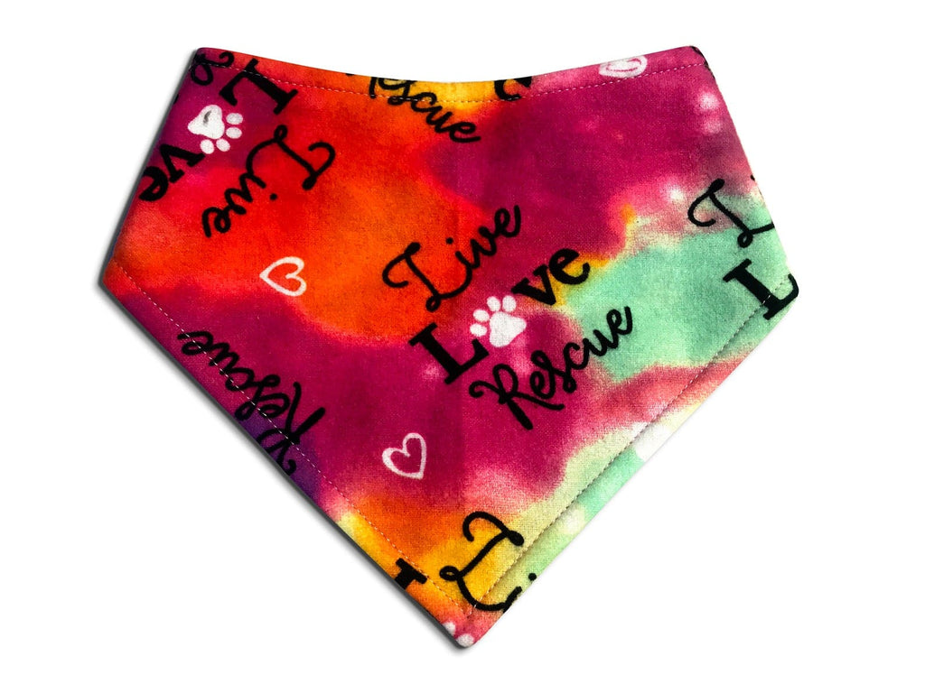 Handmade eco-friendly Live Love Rescue tie-dye bandana for dogs and cats, featuring a vibrant pattern and adjustable snap closures for a comfortable fit.