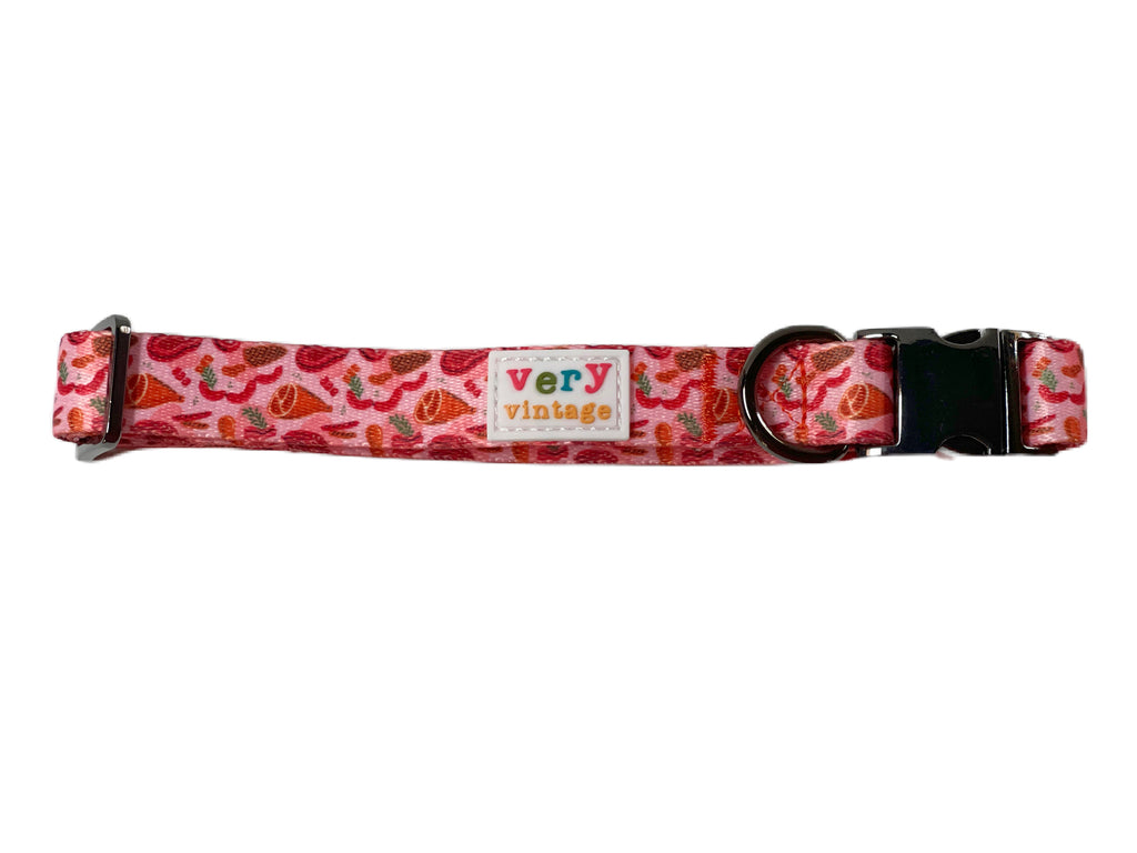 Reddish-pink meat-themed nylon dog collar made from recycled materials.