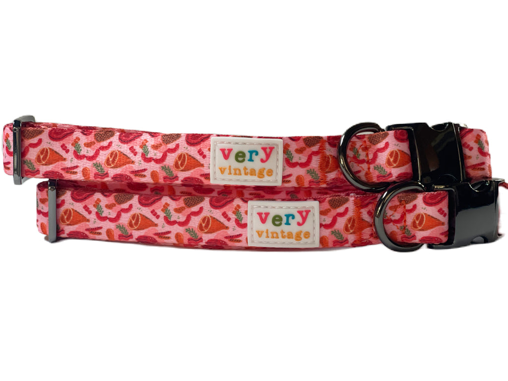 Red, pink, and orange meat-themed dog collar with durable metal hardware.