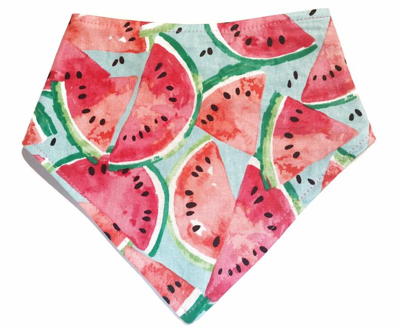 Handmade pink and green dog bandana featuring a playful watermelon pattern, eco-friendly fabric, and adjustable snap closures for a comfortable fit.