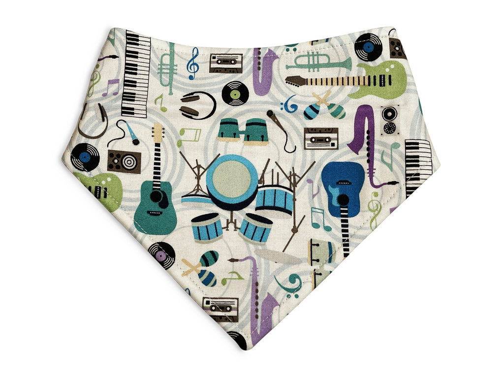 Handmade in Los Angeles. This gray and white dog and cat bandana adorned with colorful Musical Instruments. 3 snaps on back of the bandana for a secure and adjustable fit.