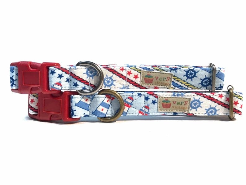 Handmade organic cotton dog collar with a nautical beach and ocean-inspired design, featuring elements like anchors, sailboats, and waves. Available in custom sizes for dogs and cats, with antique brass or silver hardware, and a breakaway buckle for added safety for cats.