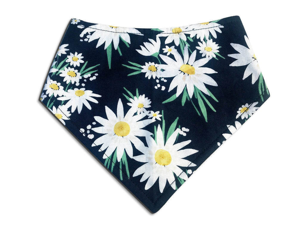 Girly Dog bandana with a navy blue background, featuring white daisies with yellow centers, adding a floral touch for a charming look. Handmade in the USA. 