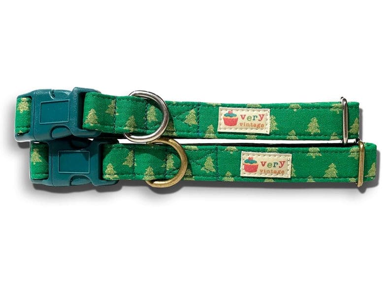 A close-up of the dark green Christmas collar showcasing the elegant gold Christmas tree pattern. Handmade from organic cotton and finished with antique brass or antique silver hardware, this collar adds a festive touch to your pet’s holiday look.
