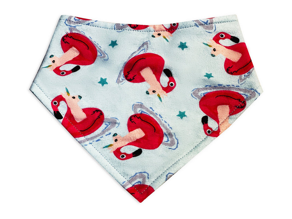 An eco-friendly snap-on bandana featuring a vibrant flamingo pattern, handmade in the USA with sustainable materials. Designed for comfort and durability, it includes adjustable snaps for a secure fit. Perfect for adding a touch of summer style to your pet's wardrobe. 