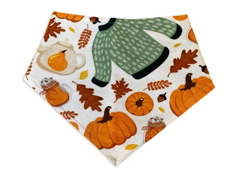 Handmade in Los Angeles. This cute dog bandana features a cream thanksgiving pattern with pumpkins, leaves, and sweaters. 3 snaps on the back for an adjustable and secure fit.