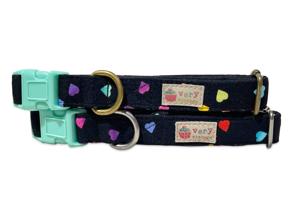 A close-up of the black collar featuring rainbow hearts, highlighting the colorful, love-filled design. Available with antique brass or antique silver hardware, this collar is perfect for Valentine’s Day or Pride celebrations.