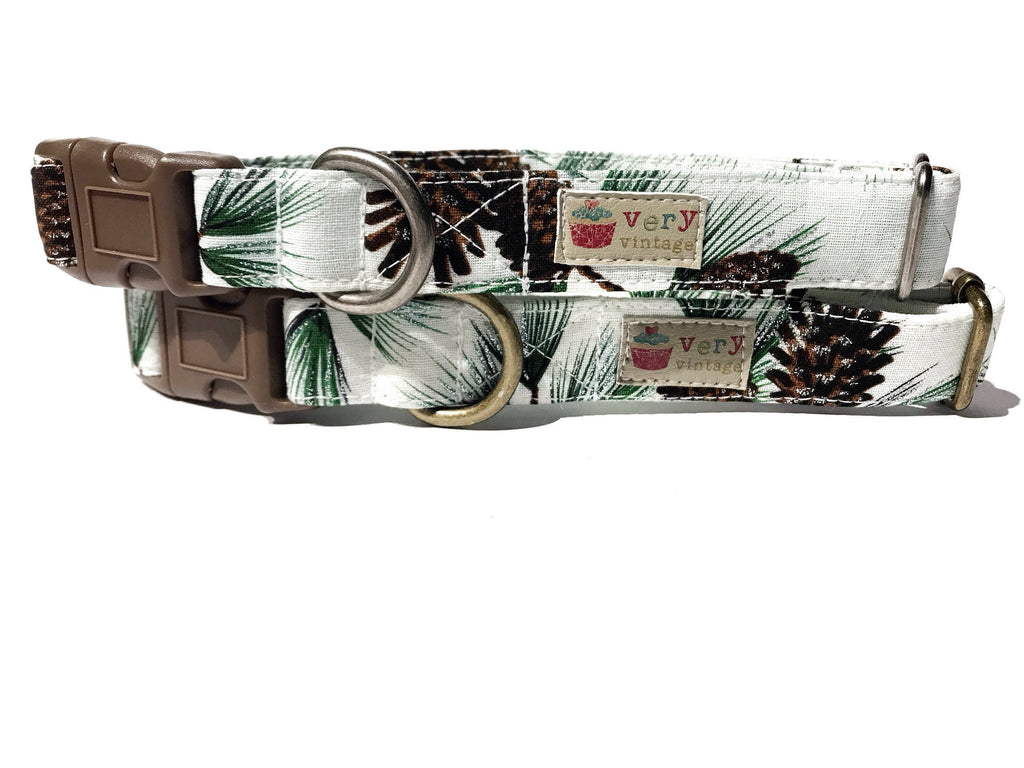 A close-up of the white collar with pinecones and pine, showcasing the wintery, holiday-inspired design. Available with antique brass or antique silver hardware, this collar adds a seasonal touch to your pet’s look. Handmade in Los Angeles. Perfect for winter.