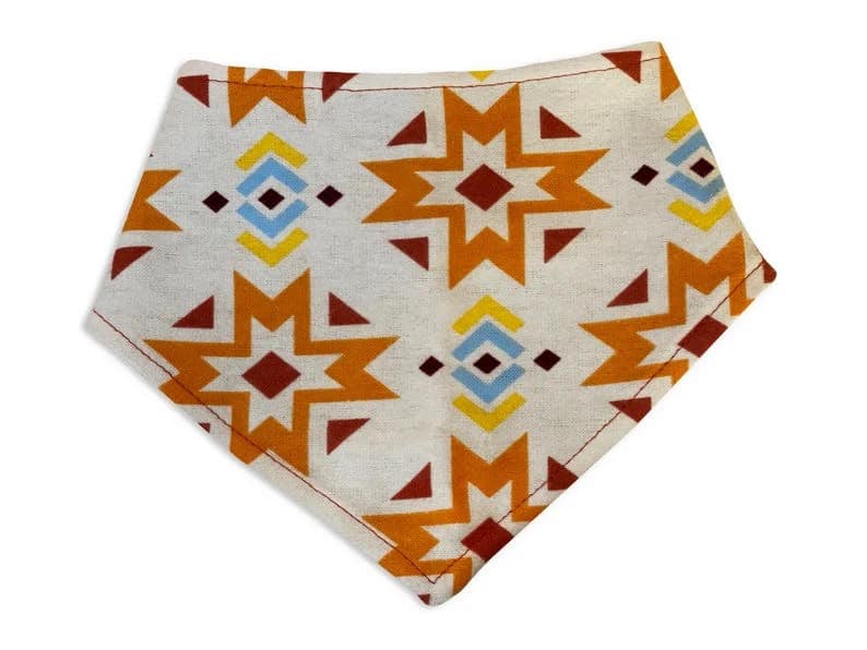 Beige with orange and brown with yellow and light blue southwestern Native American style aztec pattern dog bandana. Handmade in California. 3 snaps for an adjustable and secure fit.