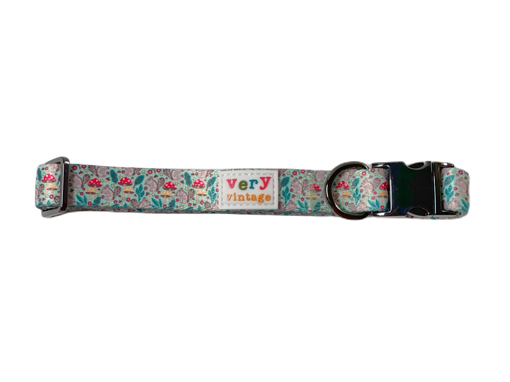 Eco-friendly mint green dog collar made from recycled materials and featuring a charming squirrel and mushroom design.