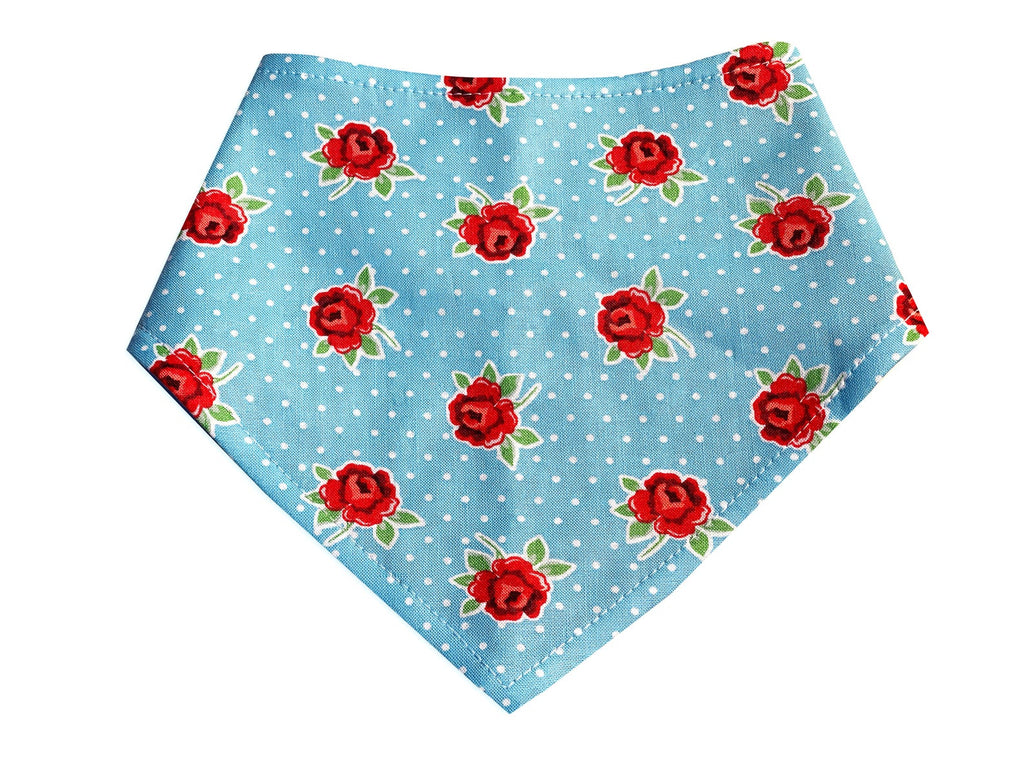 Light blue pet bandana featuring red roses and white dots. A stylish scarf accessory for both dogs and cats. Handmade in Los Angeles.