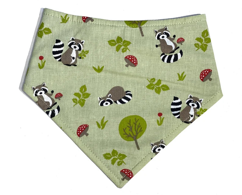 Adorable dog and cat bandanas with a lime green background with cute red mushrooms and raccoons. Handmade in the USA. Definite Fall vibes.