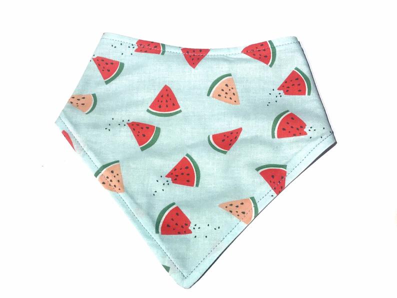 Handmade in California. This dog bandana has a mint background with pink and red watermelon slices. 3 snaps on the back for an adjustable and secure fit. 